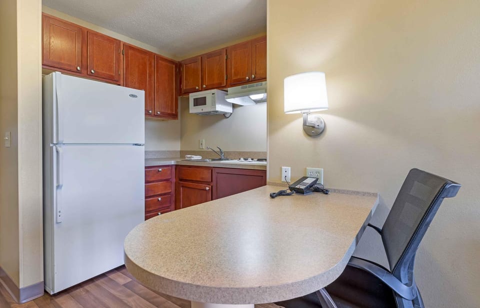 Suite, 1 King Bed with Sofa bed, Non Smoking | Private kitchen | Full-size fridge, microwave, stovetop, dishwasher
