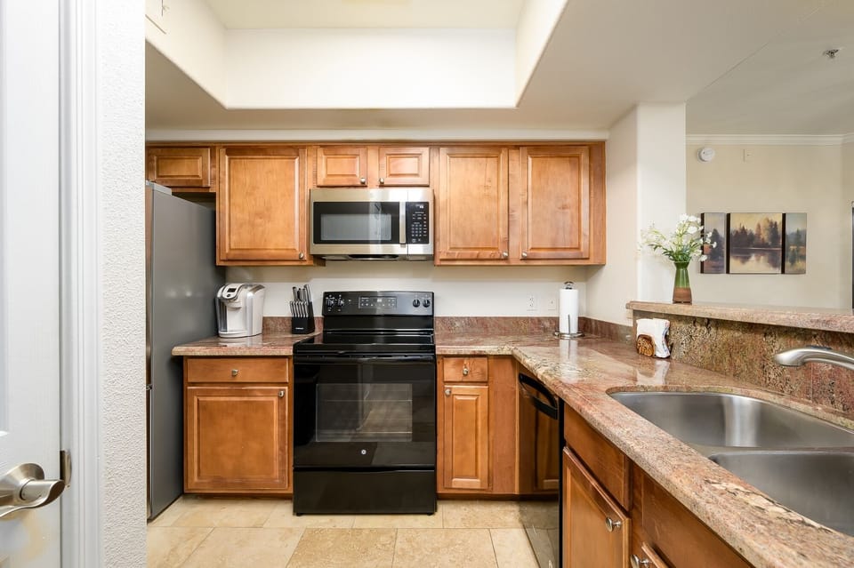 Condo, 2 Bedrooms | Private kitchen | Fridge, microwave, oven, dishwasher