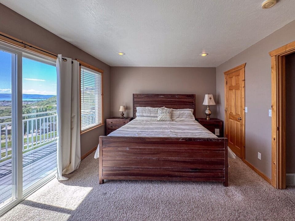 Wake up to breathtaking lake views from this peaceful king suite with private deck access.