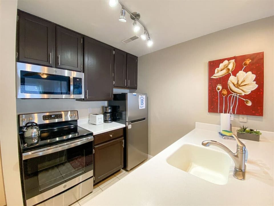 Bright, modern kitchen with sleek appliances and cozy dining space—perfect for cooking and gathering together