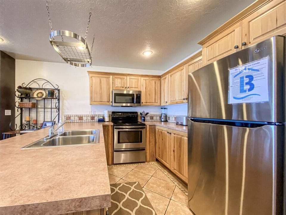 Bright kitchen with stainless steel appliances and generous counter space