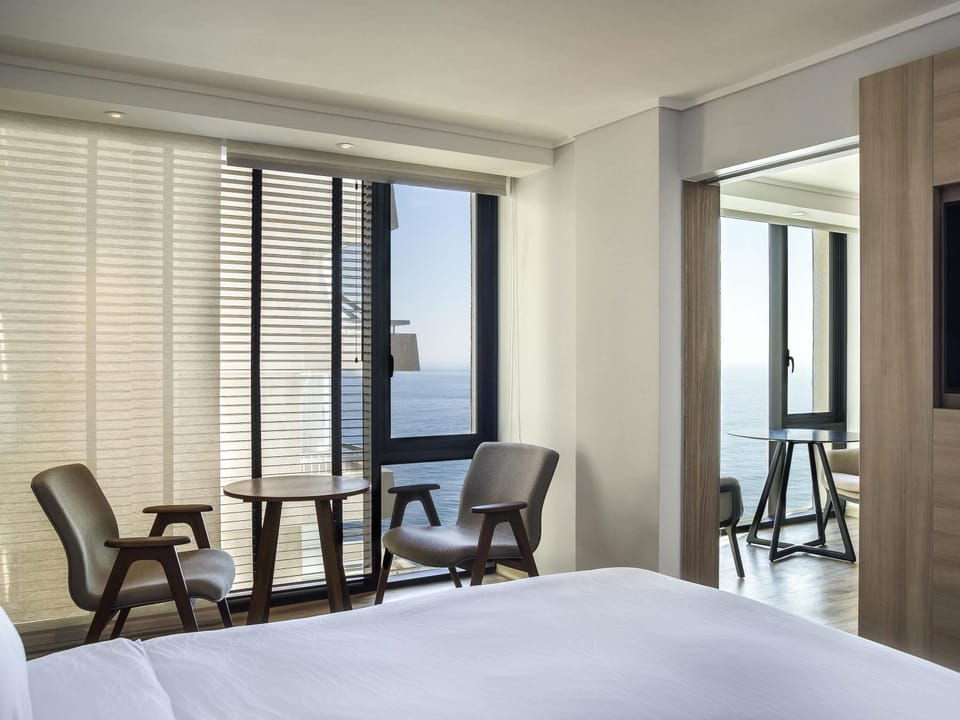 Superior Suite, 1 large double bed, partial sea view | Minibar, in-room safe, desk, laptop workspace