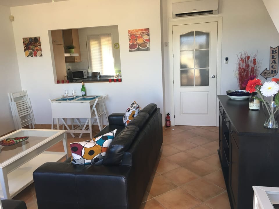 Lounge leads down to bedrooms on lower floor.