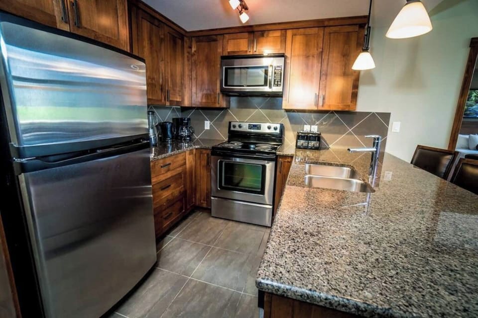 Kitchen with stainless steel appliances and granite countertops