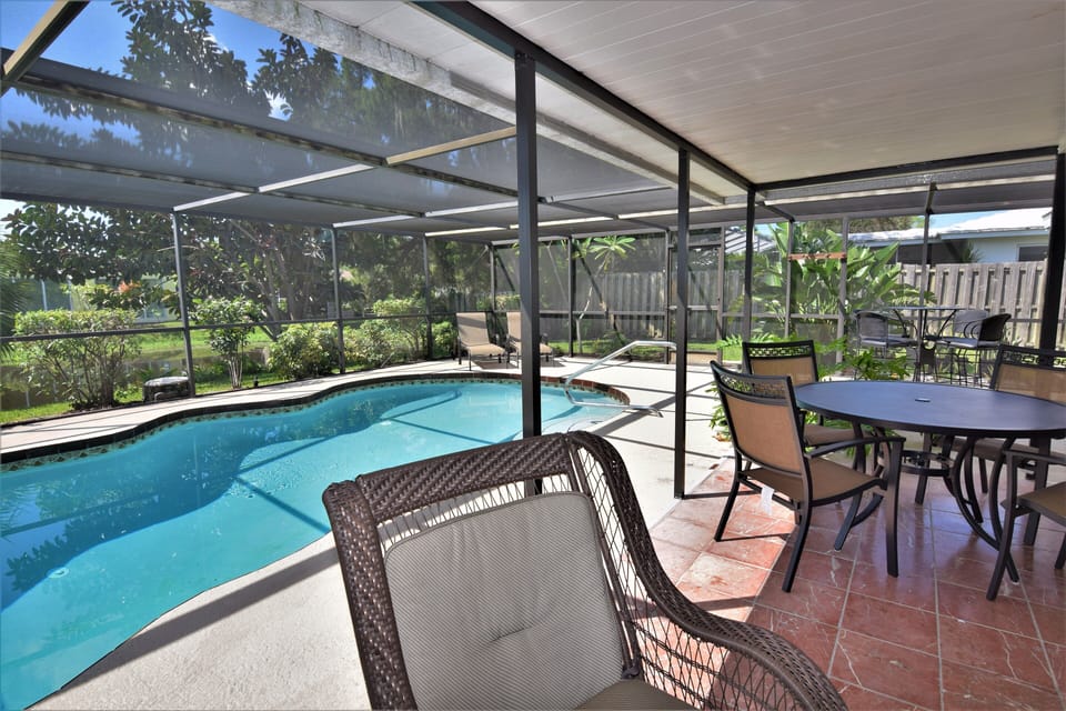 Heated Pool with outside pattio and dining area