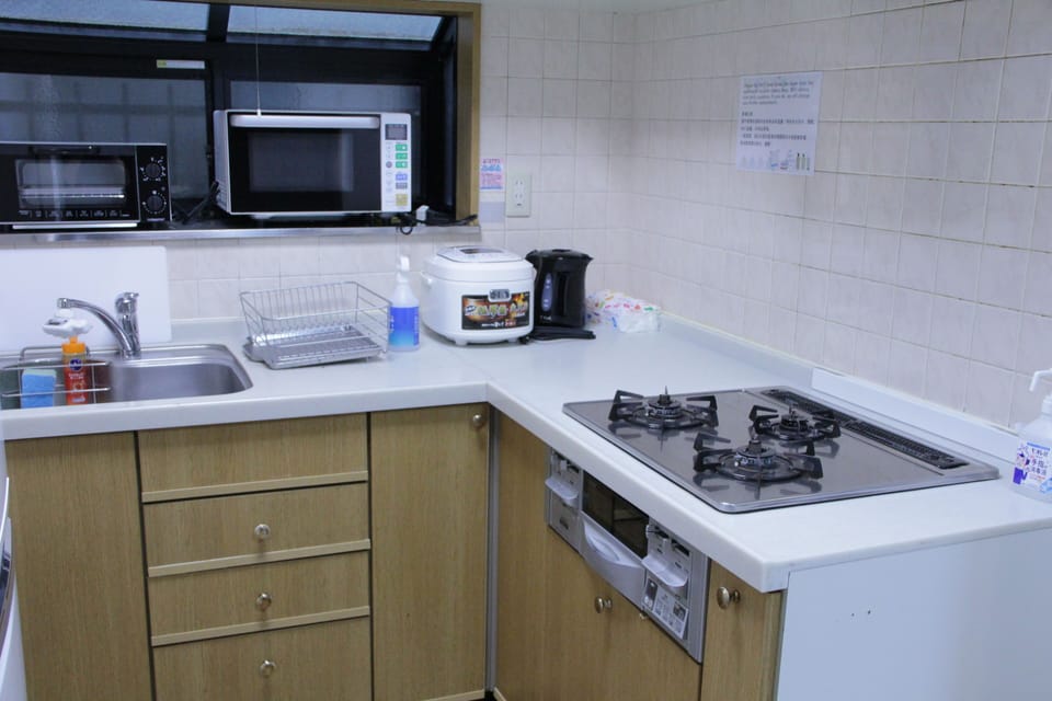 Family House | Private kitchen | Full-size fridge, microwave, stovetop, electric kettle