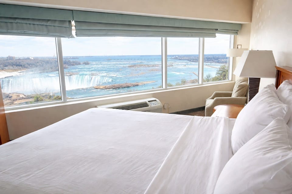 Standard Room, 1 King Bed, Jetted Tub (Falls View) | Desk, blackout drapes, iron/ironing board, free cribs/infant beds