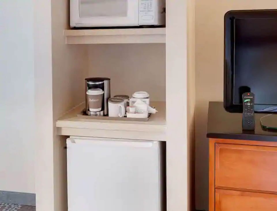 Desk, blackout drapes, iron/ironing board, free cribs/infant beds