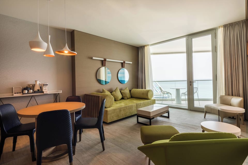 Family Suite, 2 Bedrooms, Balcony, Sea View | Living area | LED TV