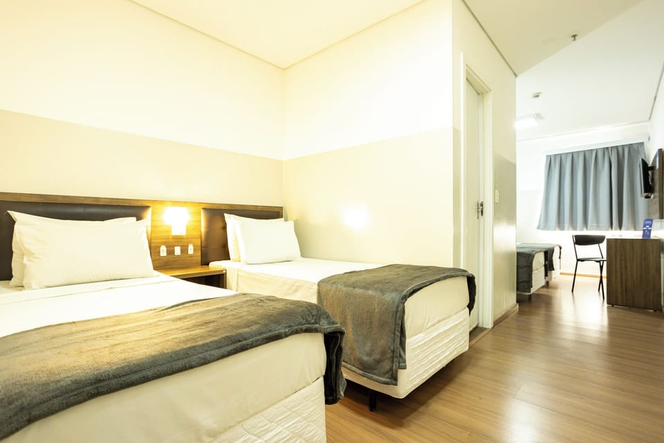 Standard Quadruple Room, Multiple Beds | Minibar, free WiFi, bed sheets