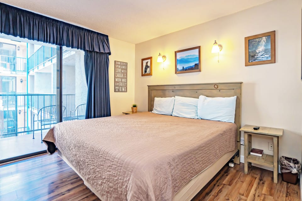 Wake up to a welcoming retreat where rustic charm meets modern comfort. Your king-size bed promises restful nights, while the private balcony invites you to savor fresh mountain air and neighborhood views.