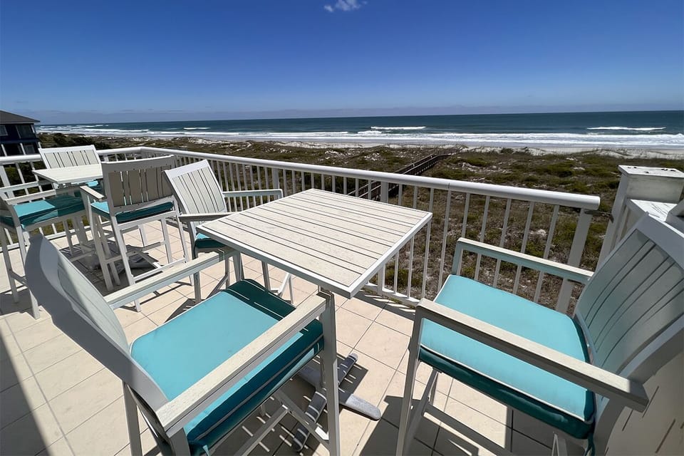 Inviting and spacious porch with comfortable seating, ideal for relaxing or dining outdoors