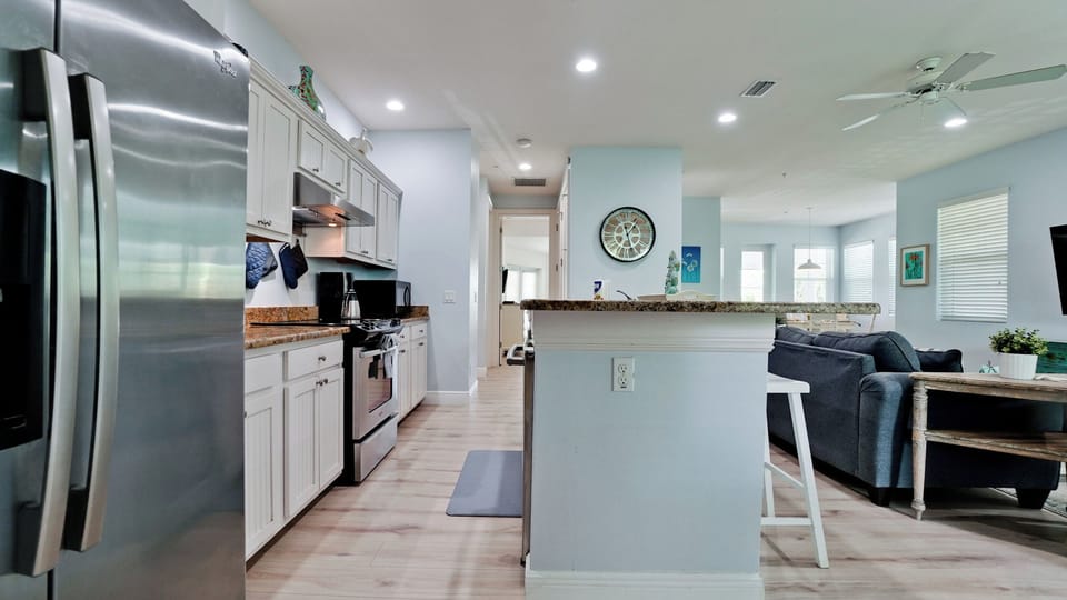 Large kitchen bar for food prep and gathering