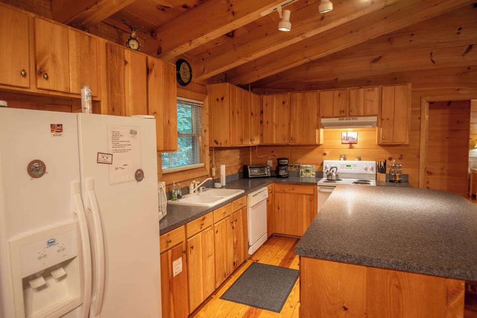 Fully-stocked kitchen with a coffee maker...