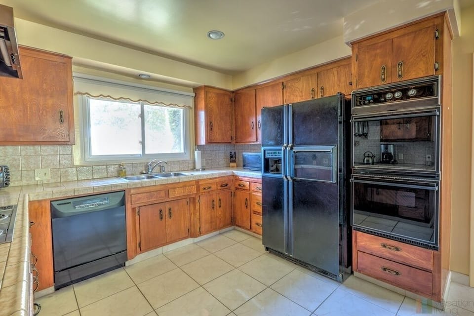 Full kitchen with dishwasher, stove and microwave