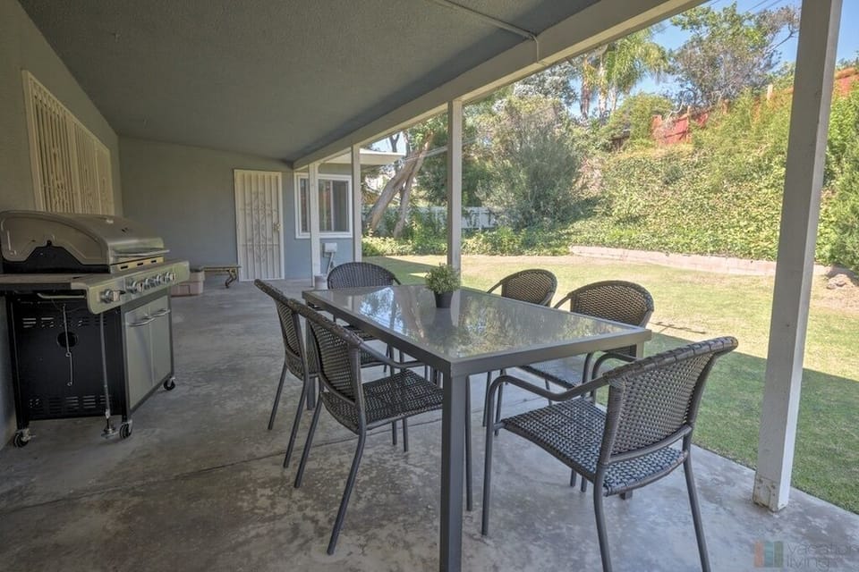 Second outdoor seating area with BBQ in the back yard