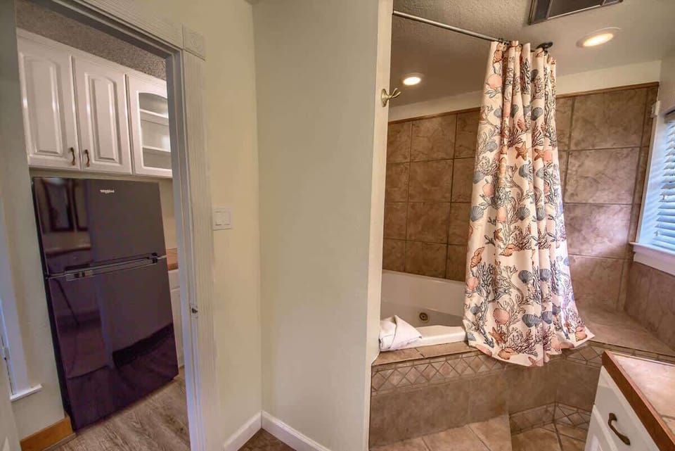 Upstairs there is a refrigerator bar area with coffee maker and sink. 