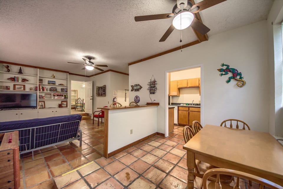 Just a few steps down from the main level is a second living area with 2 futons, dining table, bar seating and 2nd kitchen.