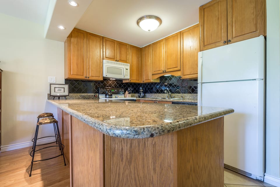 Kitchen Area With Granite Counters