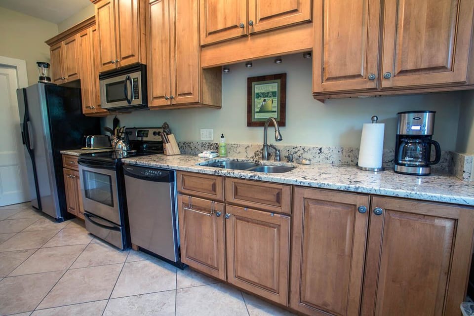 Granite counter tops and stainless steel appliances.