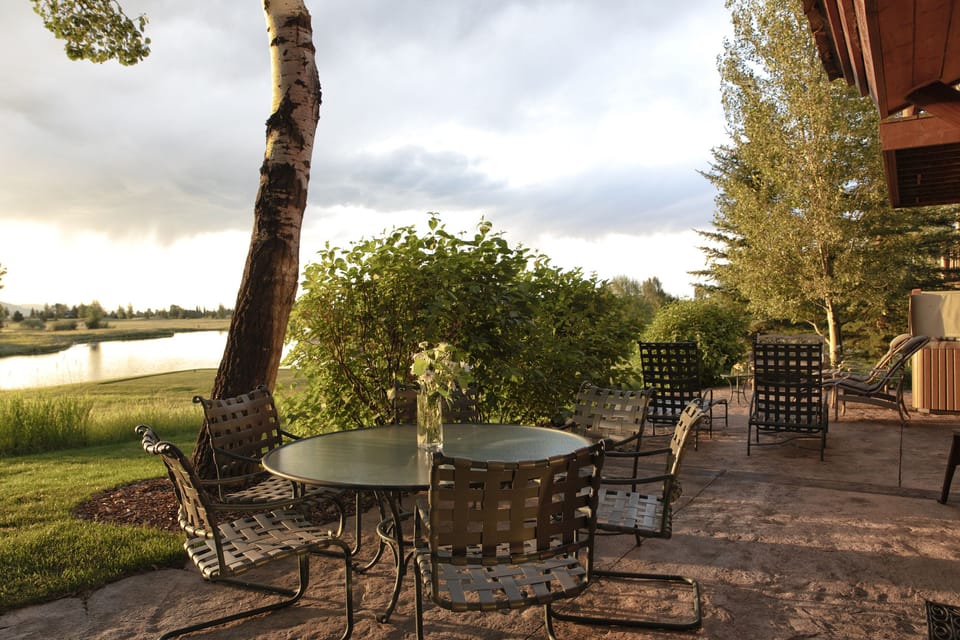 Picture yourself unwinding on this tranquil patio as golden hour light dances across the lake. The gentle sounds of water and rustling leaves create your perfect evening retreat.