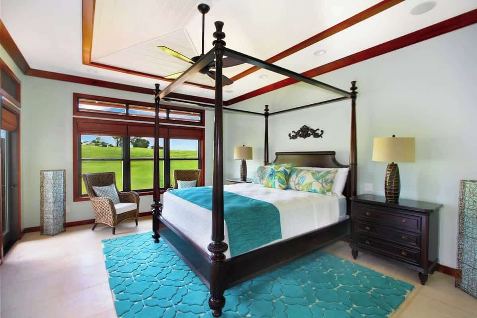 Master Bedroom Suite features A/C, Ceiling Fans, King Bed, Ensuite bath with indoor and outdoor shower