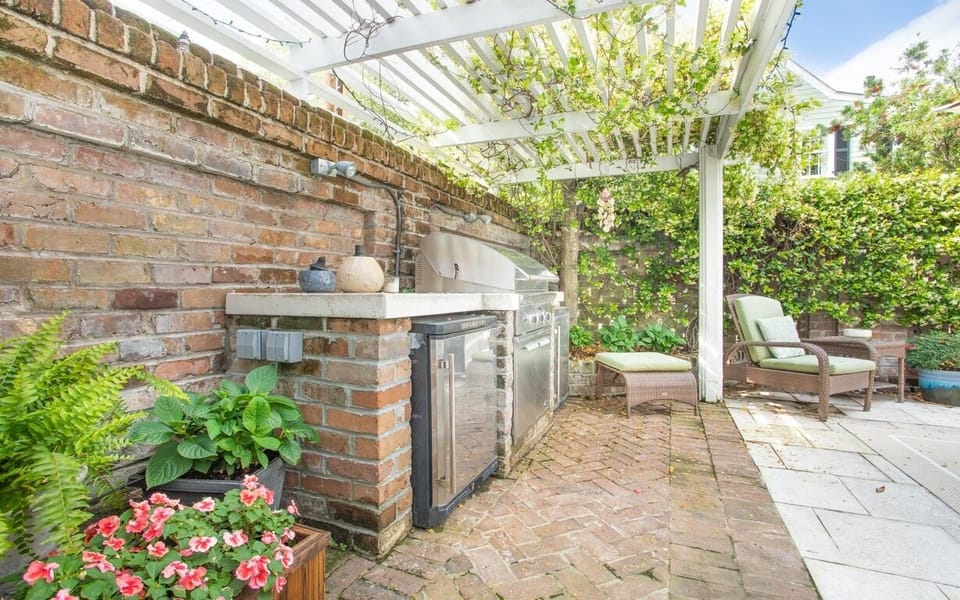 The private back courtyard with built-in grill and refrigerators.