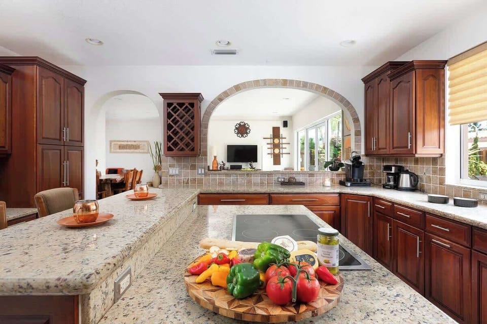 A large and beautiful kitchen with a view of the kitchen.