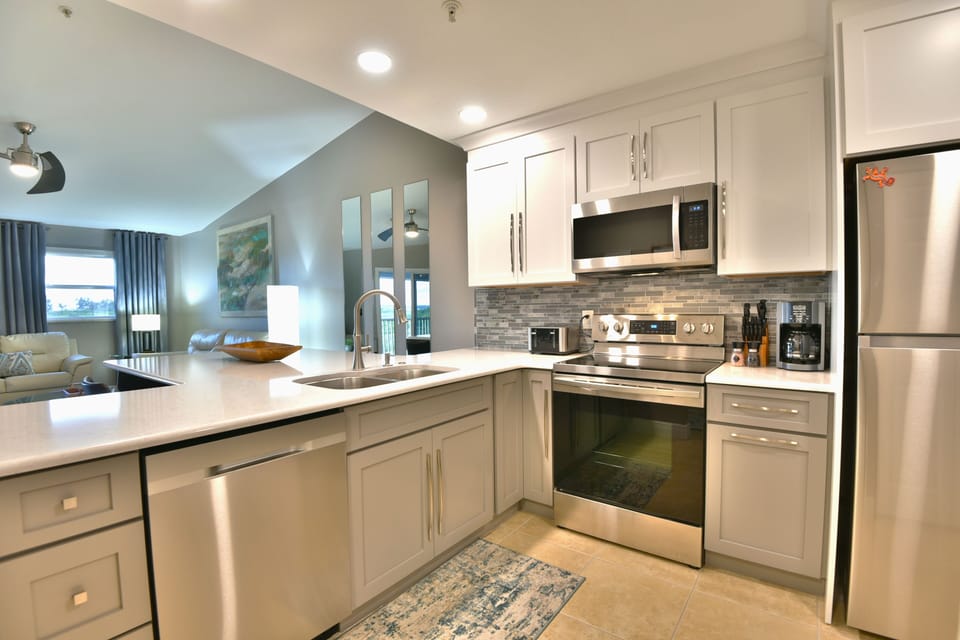 Kitchen showing stove, range hood, and ample counter space