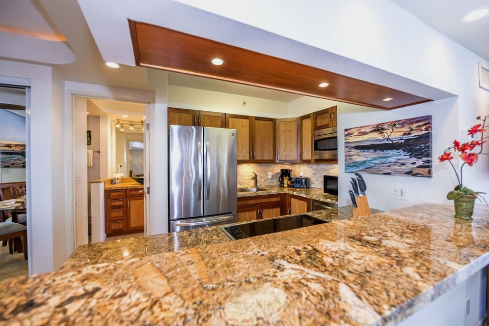 beautiful granite counter tops and remodeled kitchen