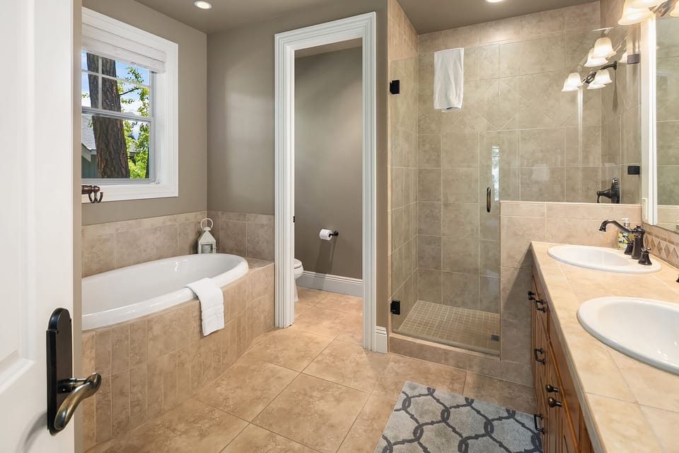 Pine Cone: - Main floor master bath with a tile shower and large soaking tub.