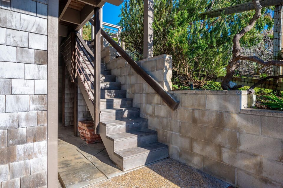 Stairs - The stairs leading to the front door.