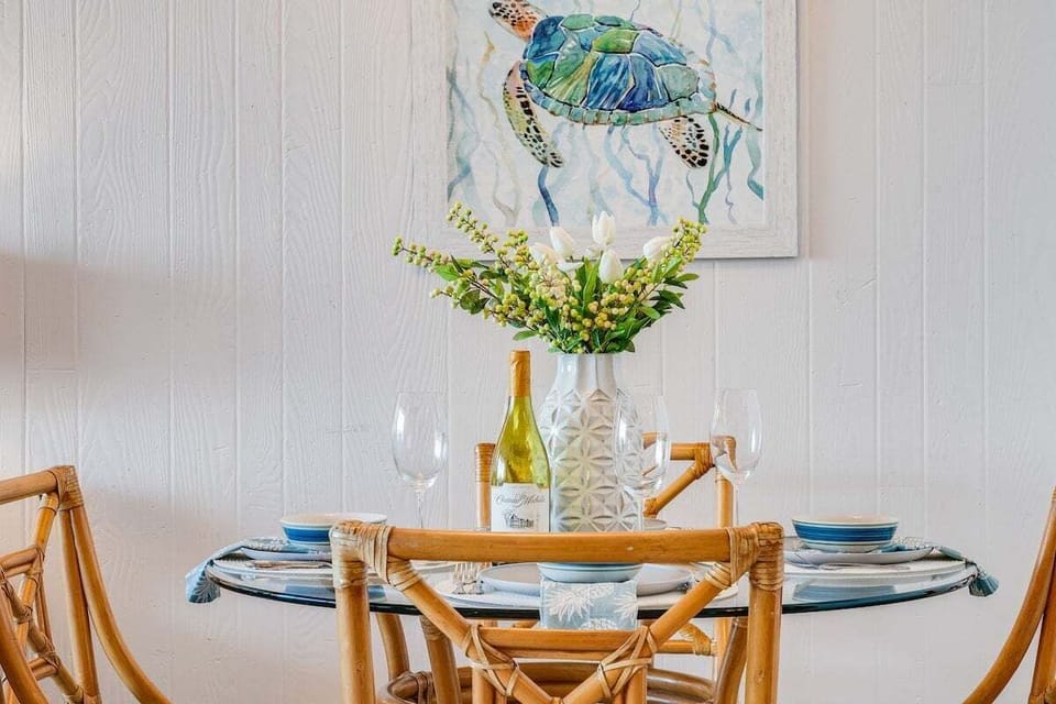 Enjoy home-cooked meals at the bright dining table adjacent to the kitchen