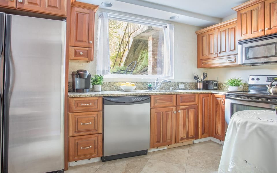 The bright and sunny kitchen is equipped with everything you'd need.