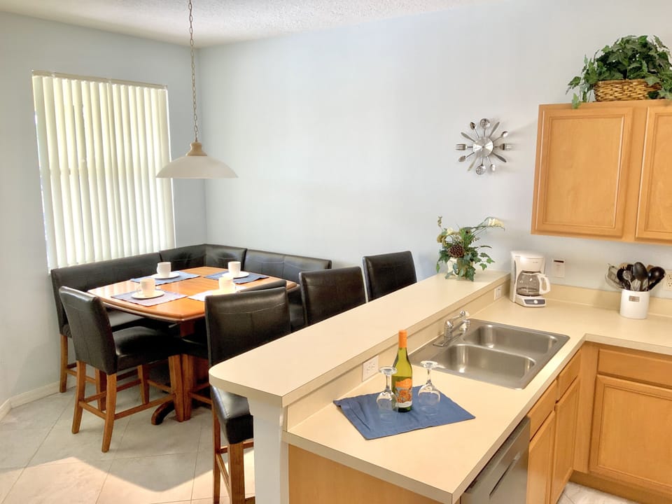 Kitchen with breakfast counter and seating area for up to 8 people.