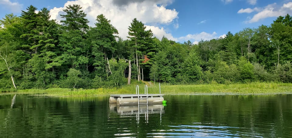 The swimming raft is 100 yards from cabin (take canoe). Water is 10-13 ft. deep.