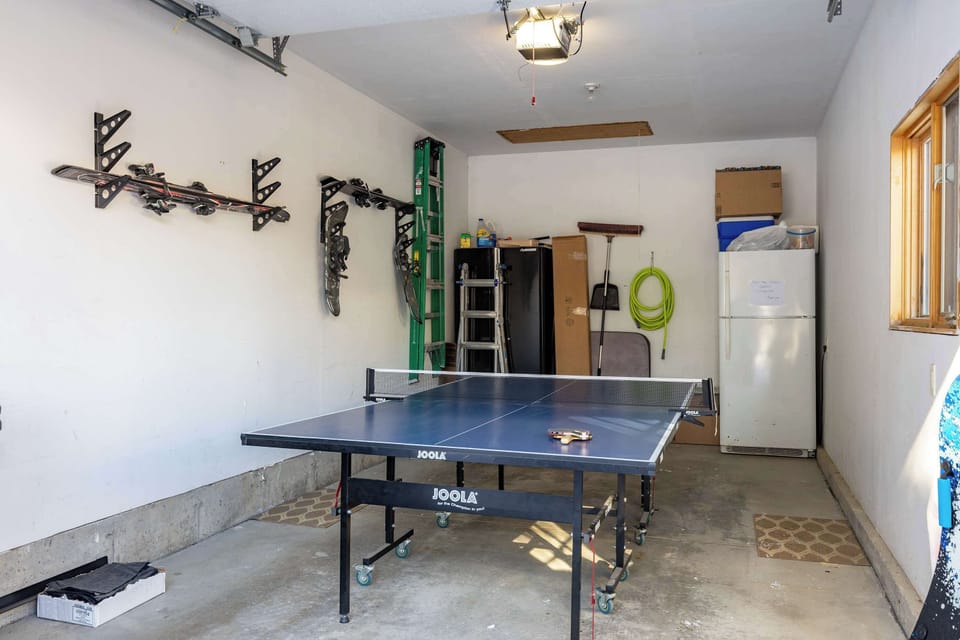 A ping pong table, paddles, and balls are available in the garage for a fun and competitive game anytime during the summer.