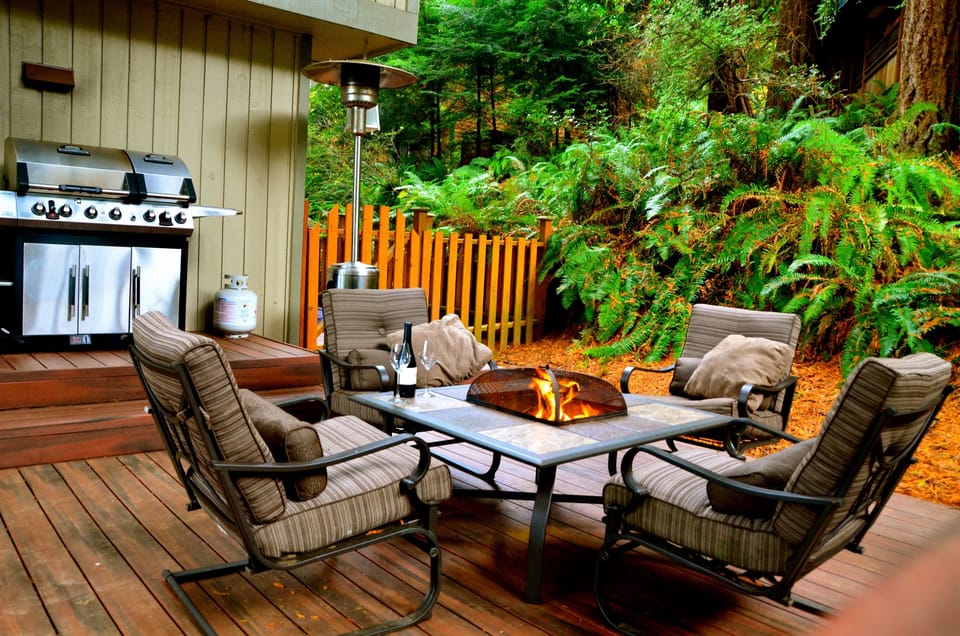 Comfortable furniture with fire pit and outdoor grill