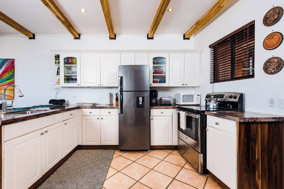 Expansive kitchen with generous counter space, full-size appliances, and everything you need to cook, blend, or brew. Ideal for extended stays, surf trips, or remote work living in Tamarindo’s most walkable beachside location.