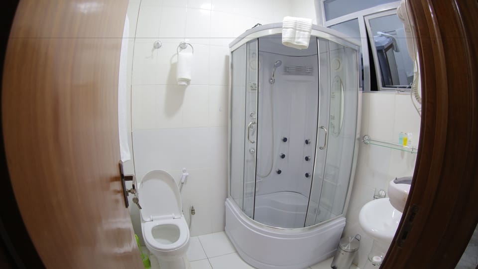 Separate tub and shower, free toiletries, slippers, towels