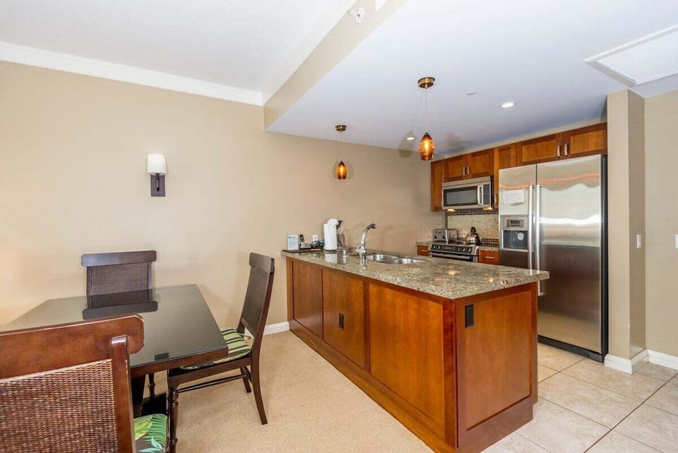 Spacious kitchen featuring granite countertops and stainless steel appliances