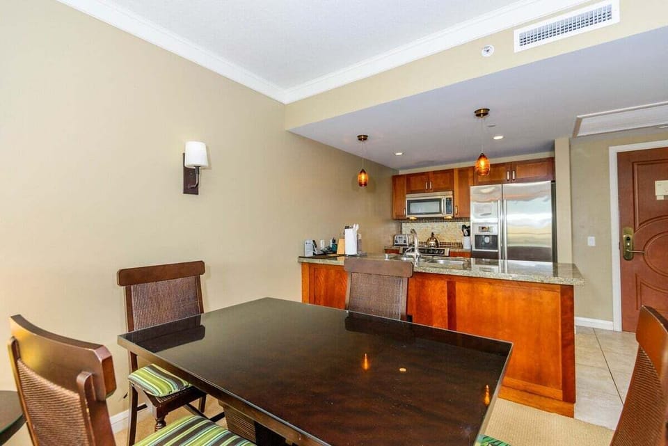 Comfortable dining space with seating for four and easy access to the kitchen