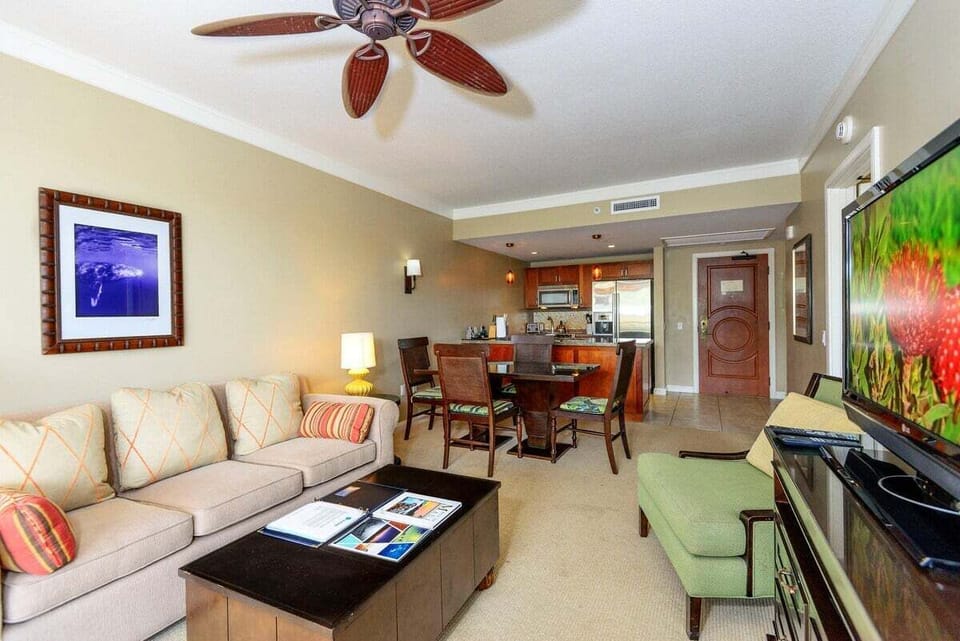 Living room features comfortable sofa, perfect for gathering and lounging