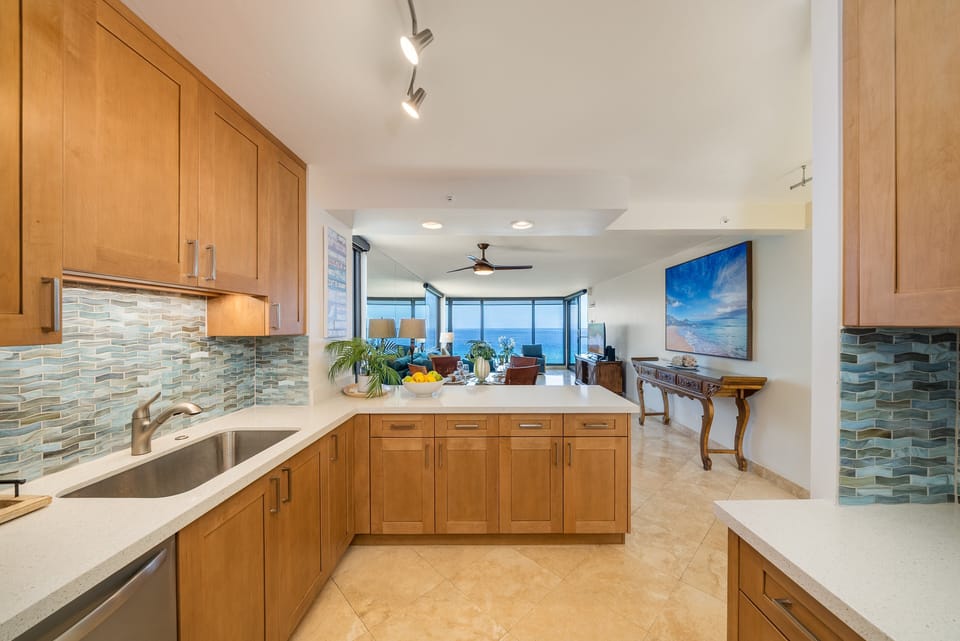 A functional and stylish kitchen designed for convenience and relaxation, overlooking the ocean