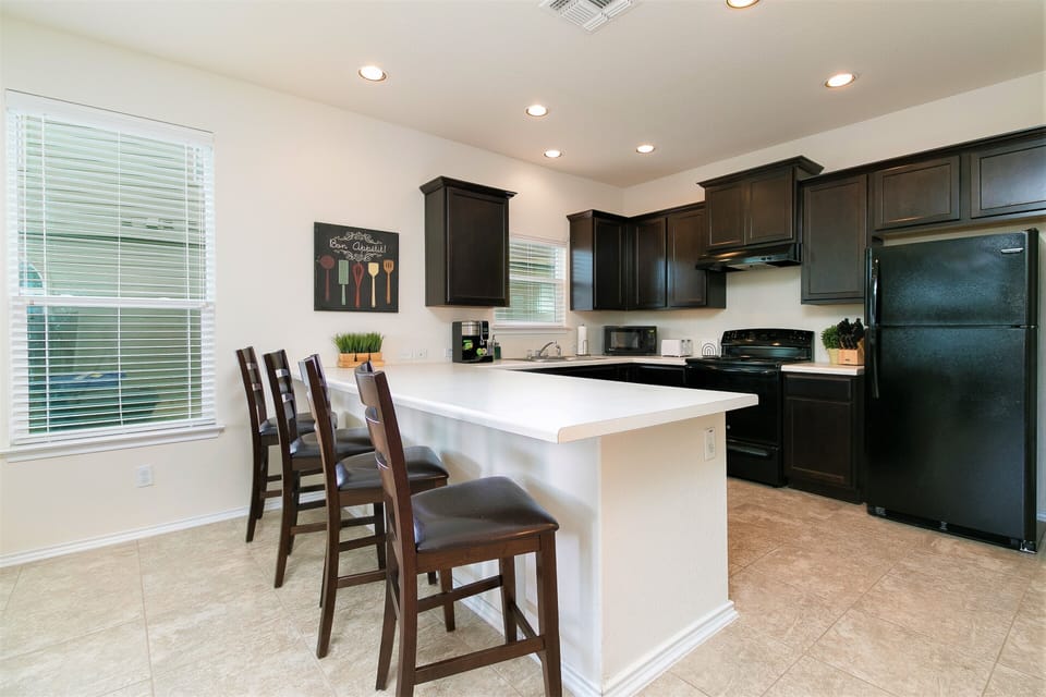 Eat in kitchen seats 4 at bar and 2 more at breakfast table (not shown).