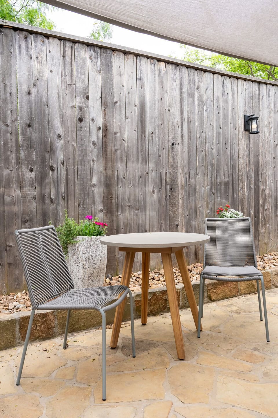 Outdoor Bistro Dining – Courtyard table for morning coffee.