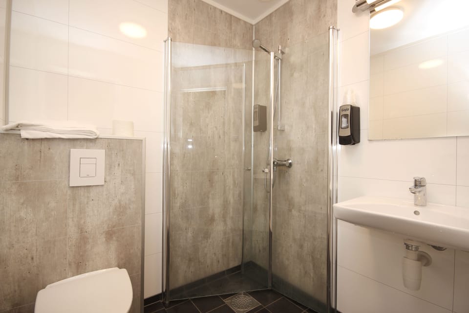 Family Room | Bathroom | Shower, towels, soap, toilet paper