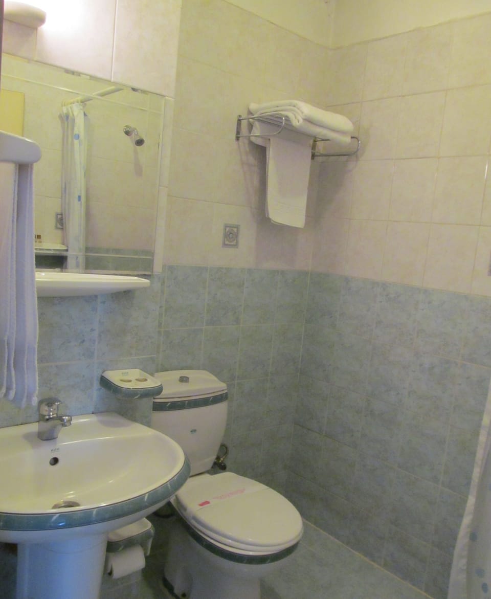 Shower, free toiletries, hair dryer, slippers