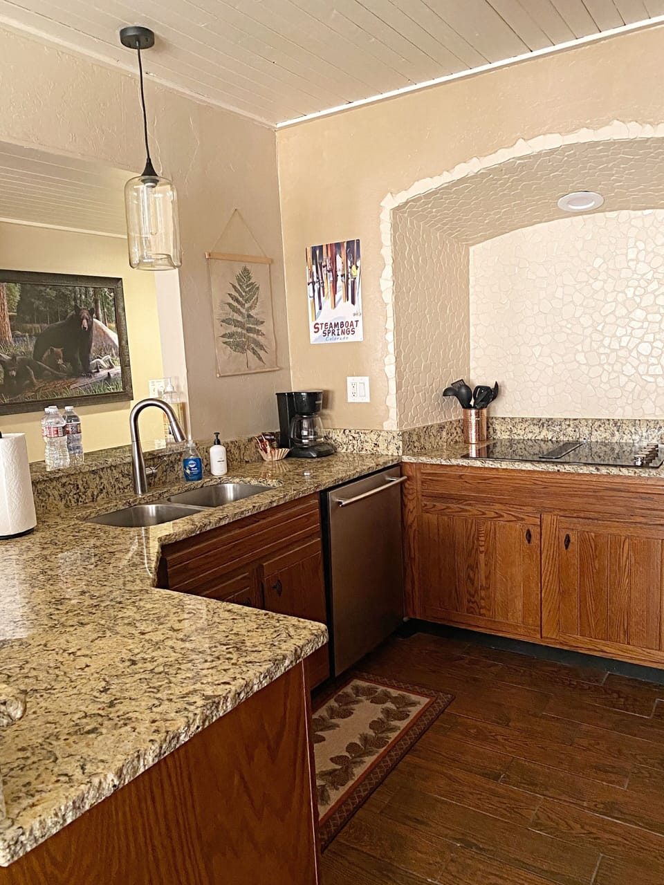 Kitchen with granite countertops and plenty of counter space for cooking.