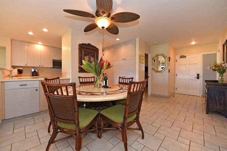 Round dining table, perfect for family meals, located adjacent to the modern kitchen